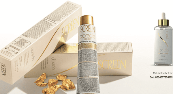 A bottle of screen cream next to some gold nuggets.