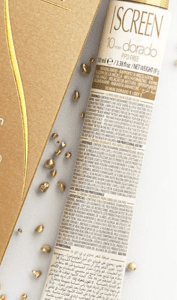 A close up of the newspaper with some grains on it